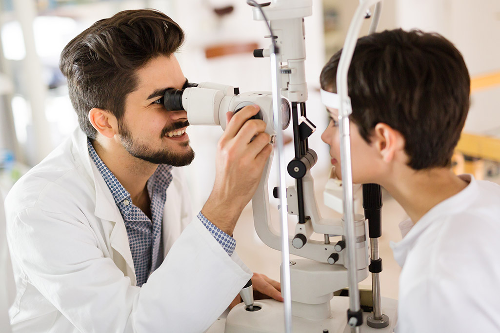 Optometrist working with client